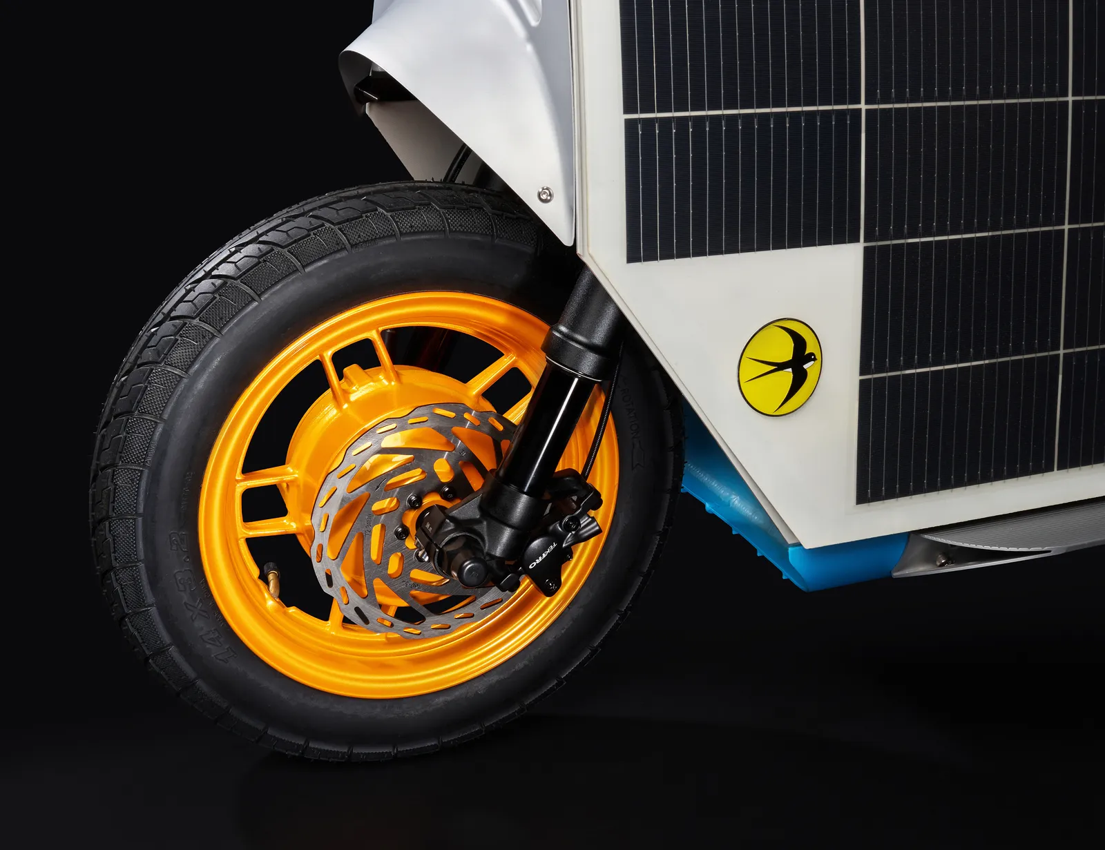 Inverted front fork and orange wheel from the front