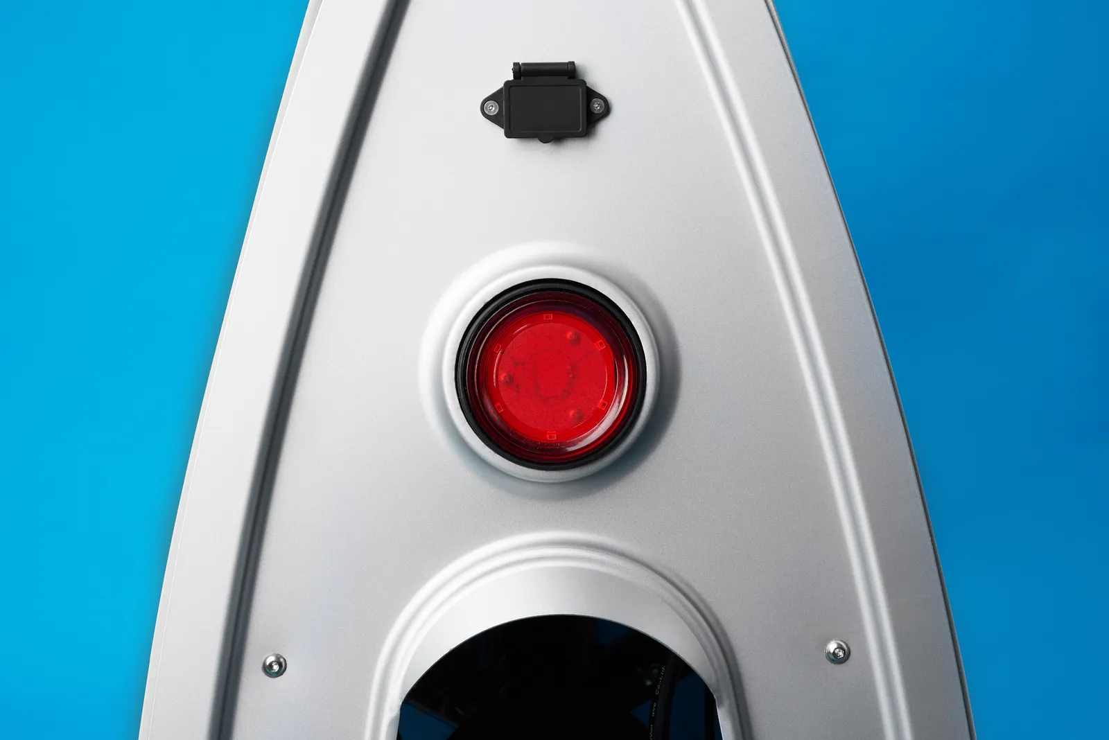 Rear of the Lightfoot showing the round tail light and the charging-port cover