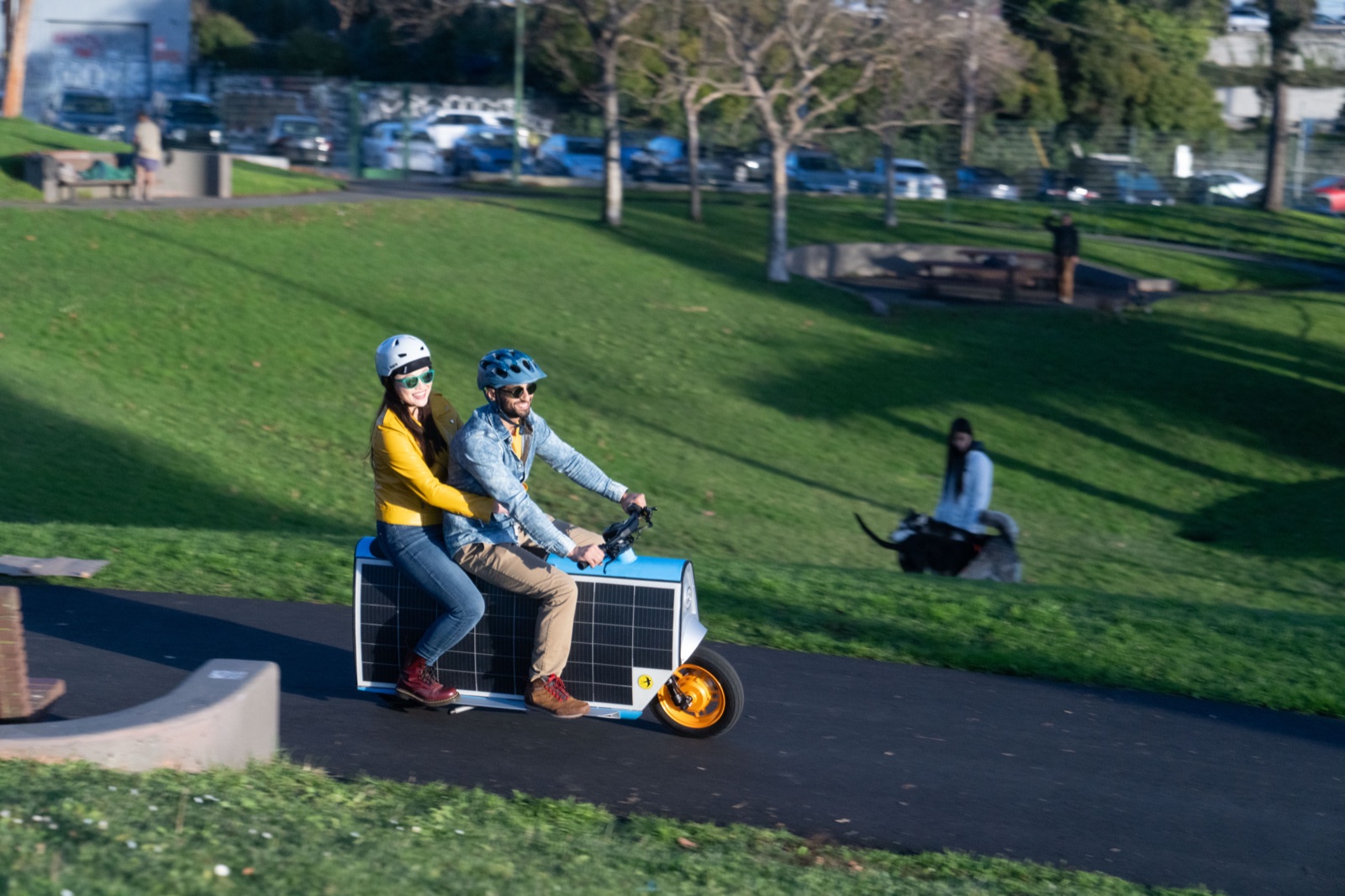 Two riders cruising through a park